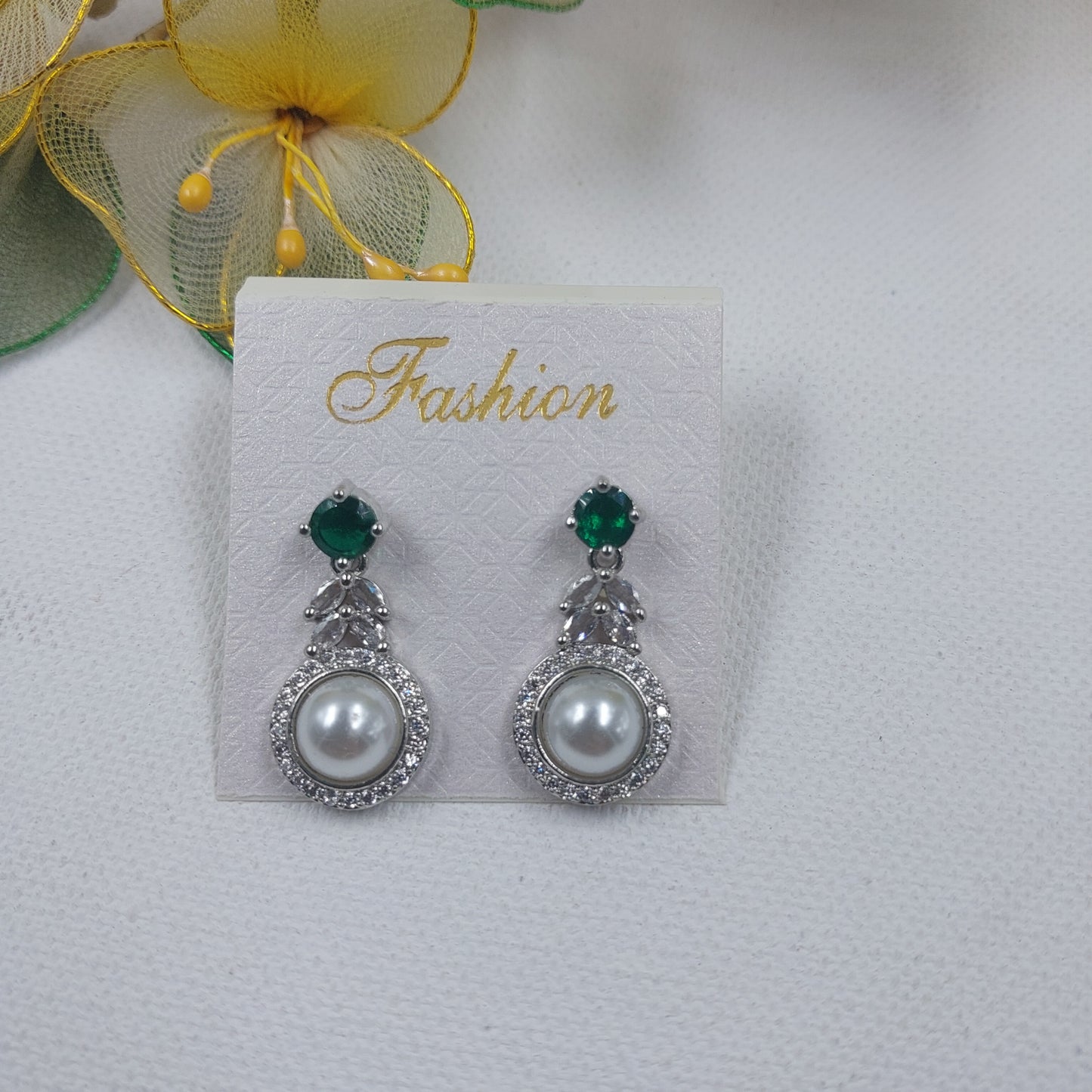 RAJAS American Diamond AD Green Stone with White Pearl and Silver Polish Earrings